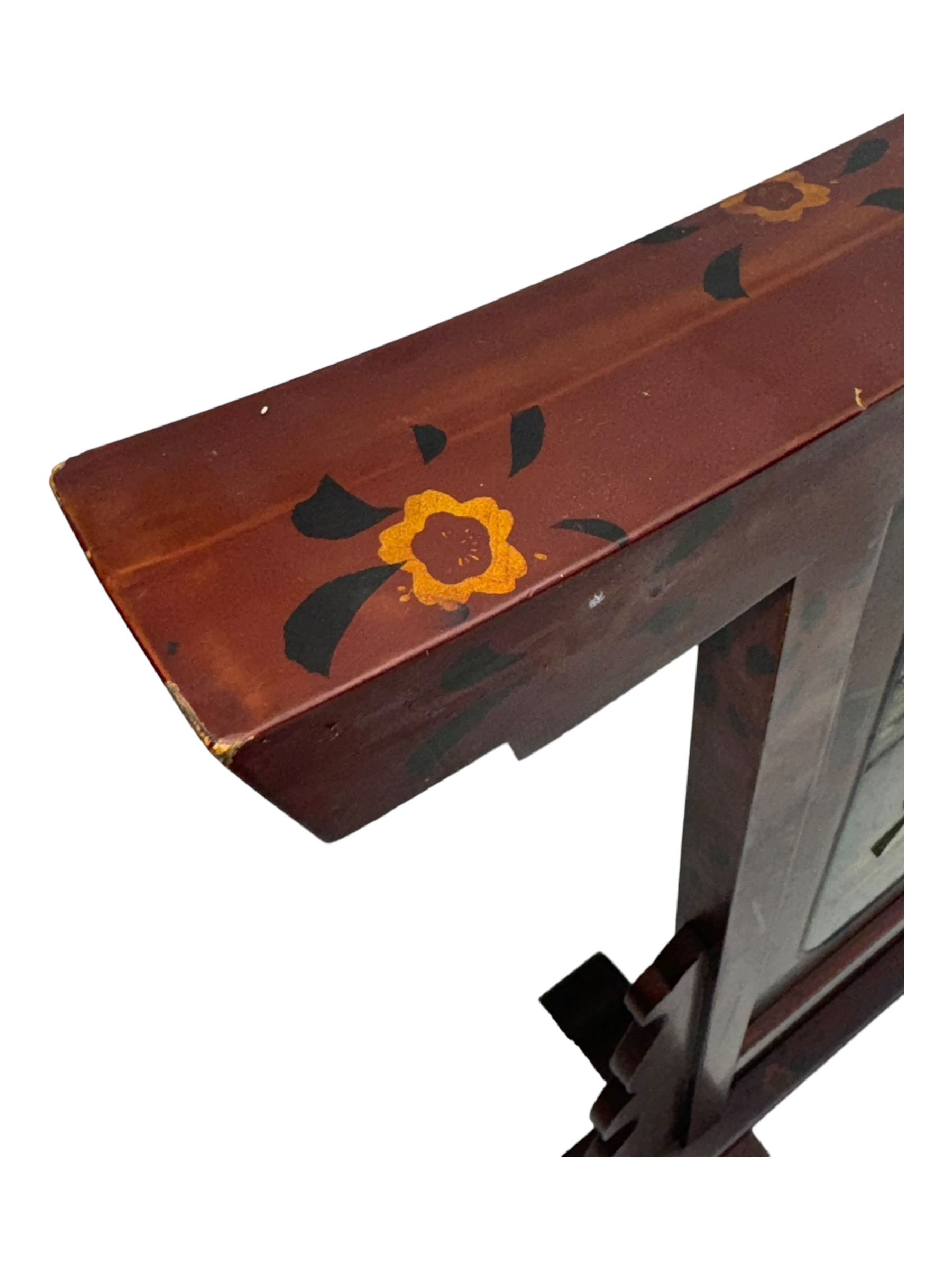 20th century Japanese lacquered table screen, top rail with slight curve and floral painted design, central panel depicting a river scene with Mount Fuji in the background, flanked by shaped supports on rectangular base