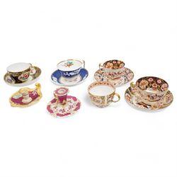 Four early 19th century Spode cups and saucers, two decorated in the Imari palette, pattern no. 2375, and two others, pattern no. 3260 & 1709, together with two early 19th century porcelain rococo revival chambersticks and another Spode tea cup (11)