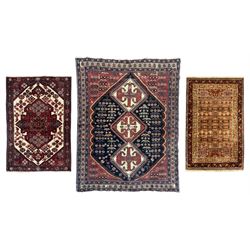 Persian Heriz wool rug, red and ivory field with floral medallion, geometric spandrels, an...