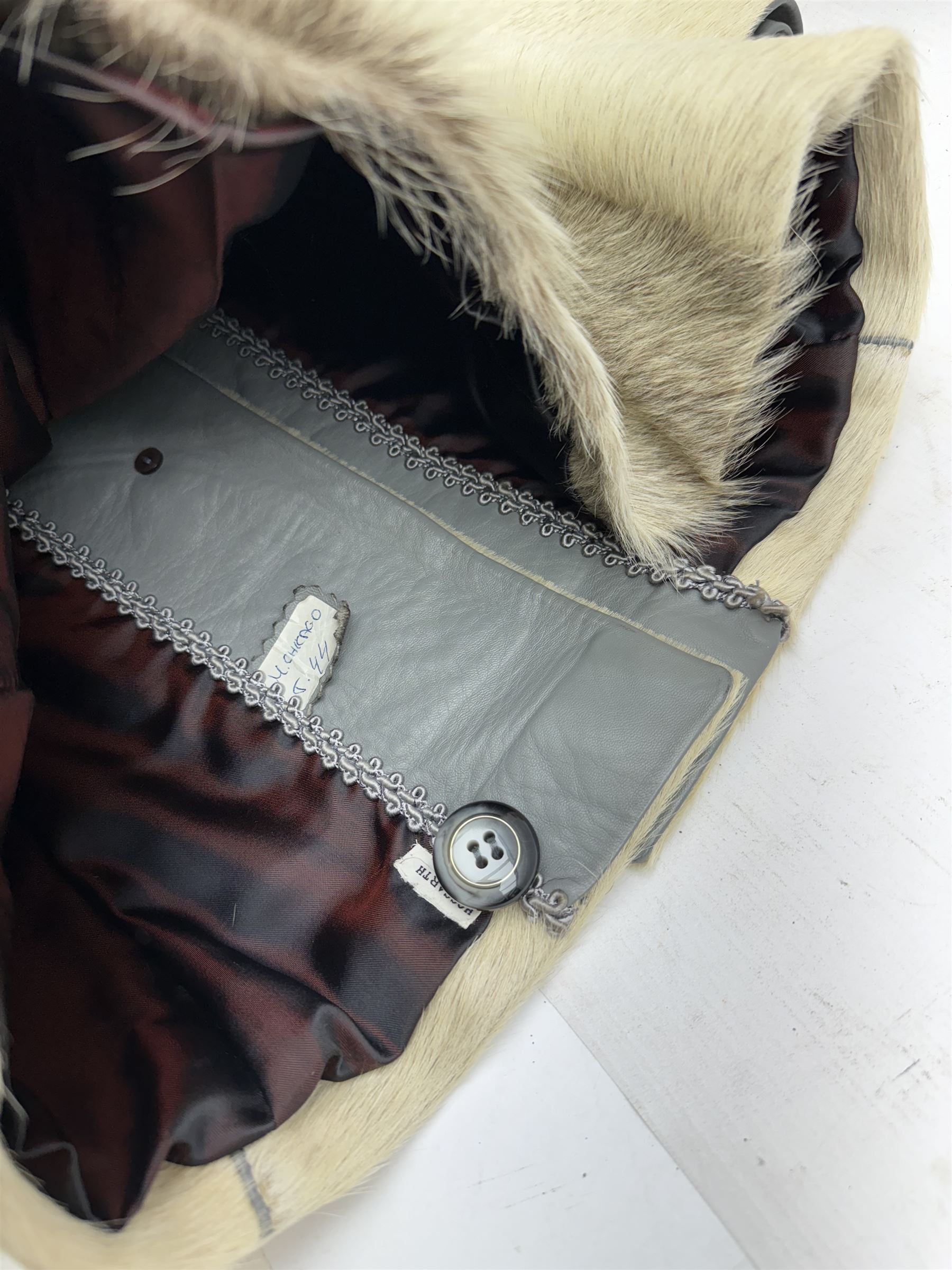 White pony hide, with grey leather sleeves and silk liner