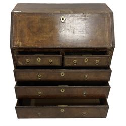 18th century walnut bureau, crossbanded and feather-banded rectangular top and fall-front, enclosing fitted interior with pigeonholes and correspondence drawers with bone handles, over two short and three long graduating drawers with moulded facias and original brass handles, on bracket feet