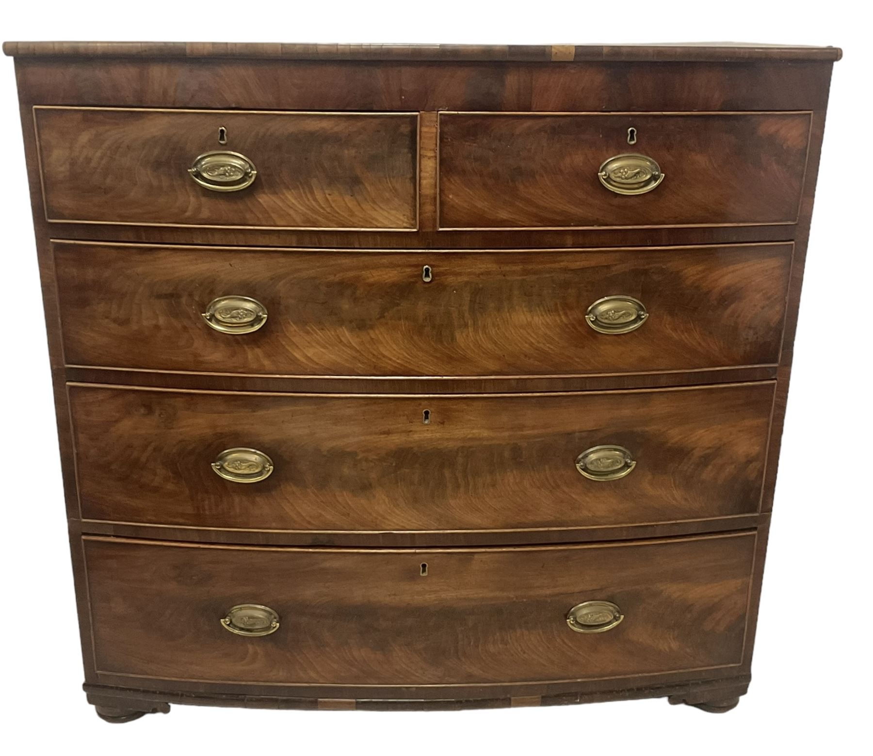 George III mahogany bow-front chest, fitted with two short over three long graduating cock-beaded drawers, on compressed bun feet