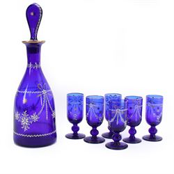 19th century style blue glass decanter and six drinking glasses, the decanter of mallet fo...