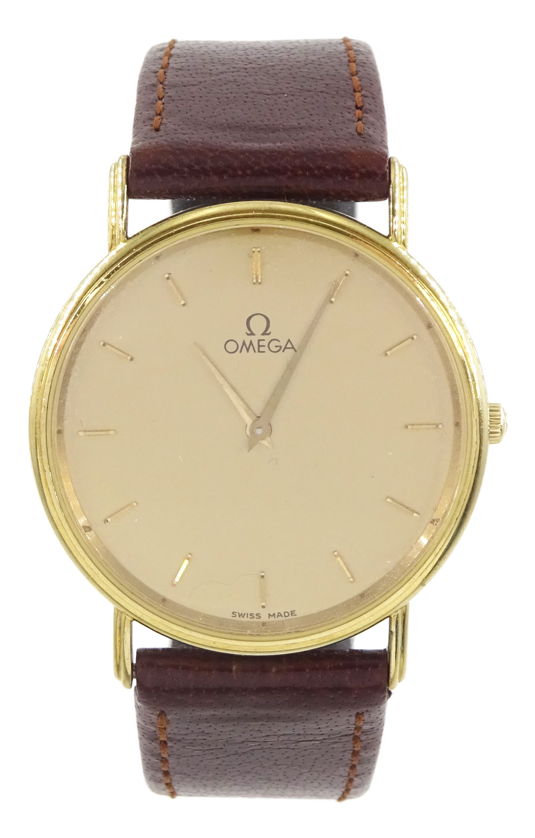 Omega gentleman's 9ct gold quartz wristwatch, champagne dial, with baton hour markers, on brown leather strap