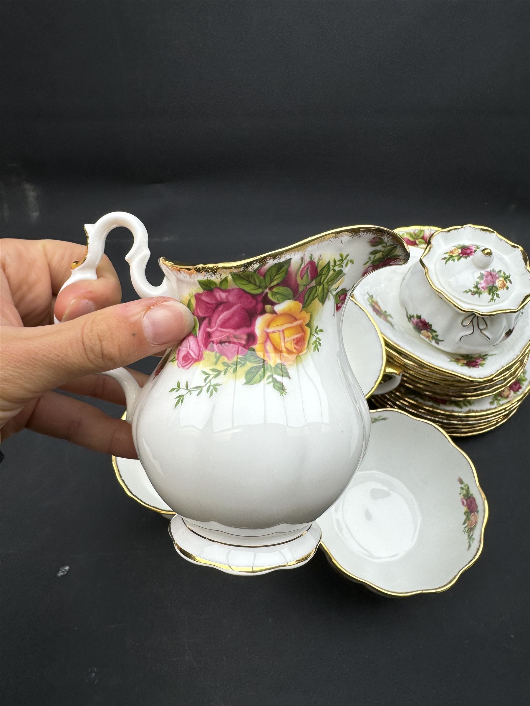 Royal Albert Old Country Roses tea service for six, comprising teapot, milk jug, open sucrier, cups and saucers, dessert plates, two trinket dishes covered jar and clock