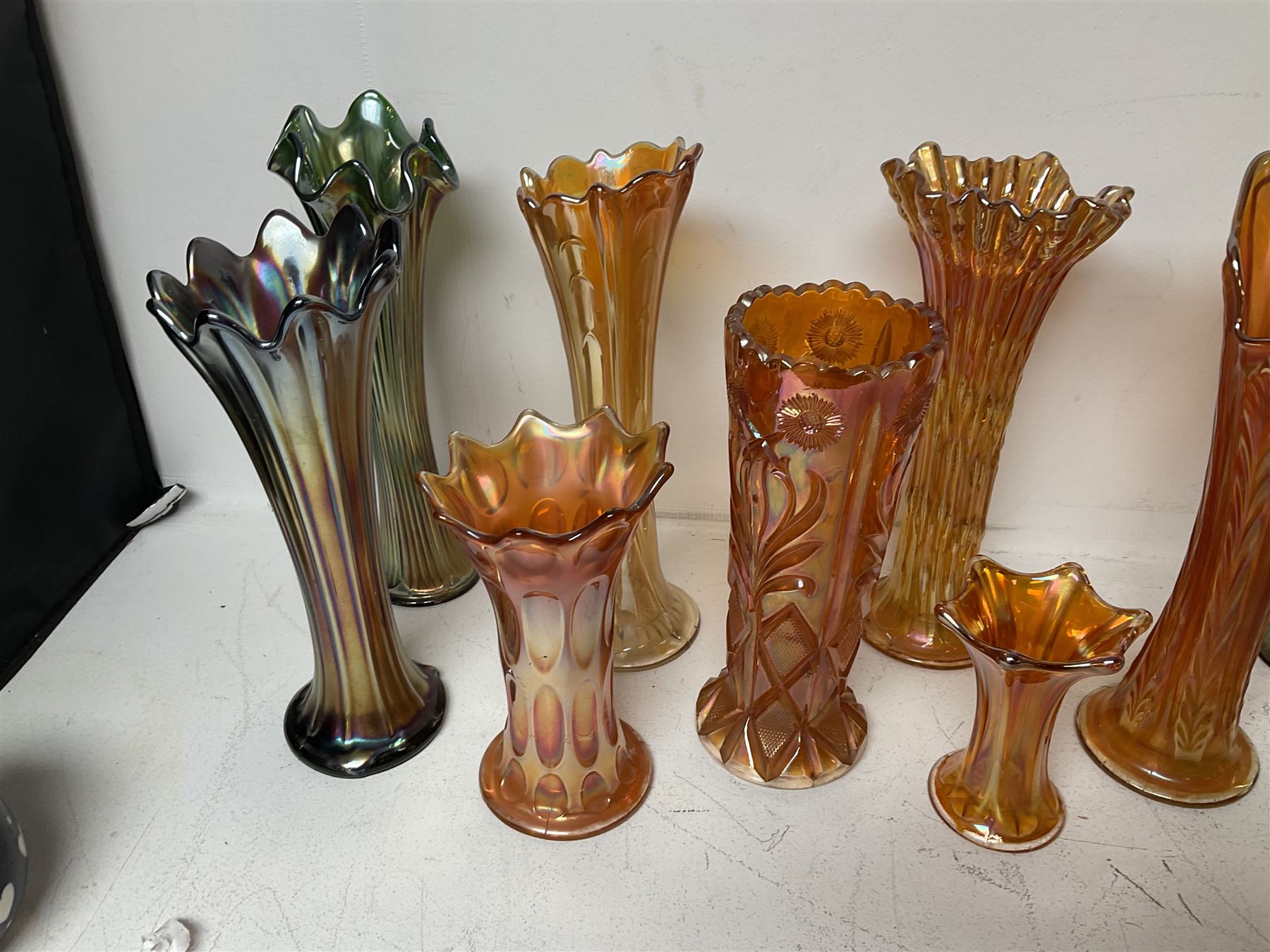 Collection of carnival glass trumpet vases and similar, largest H32cm