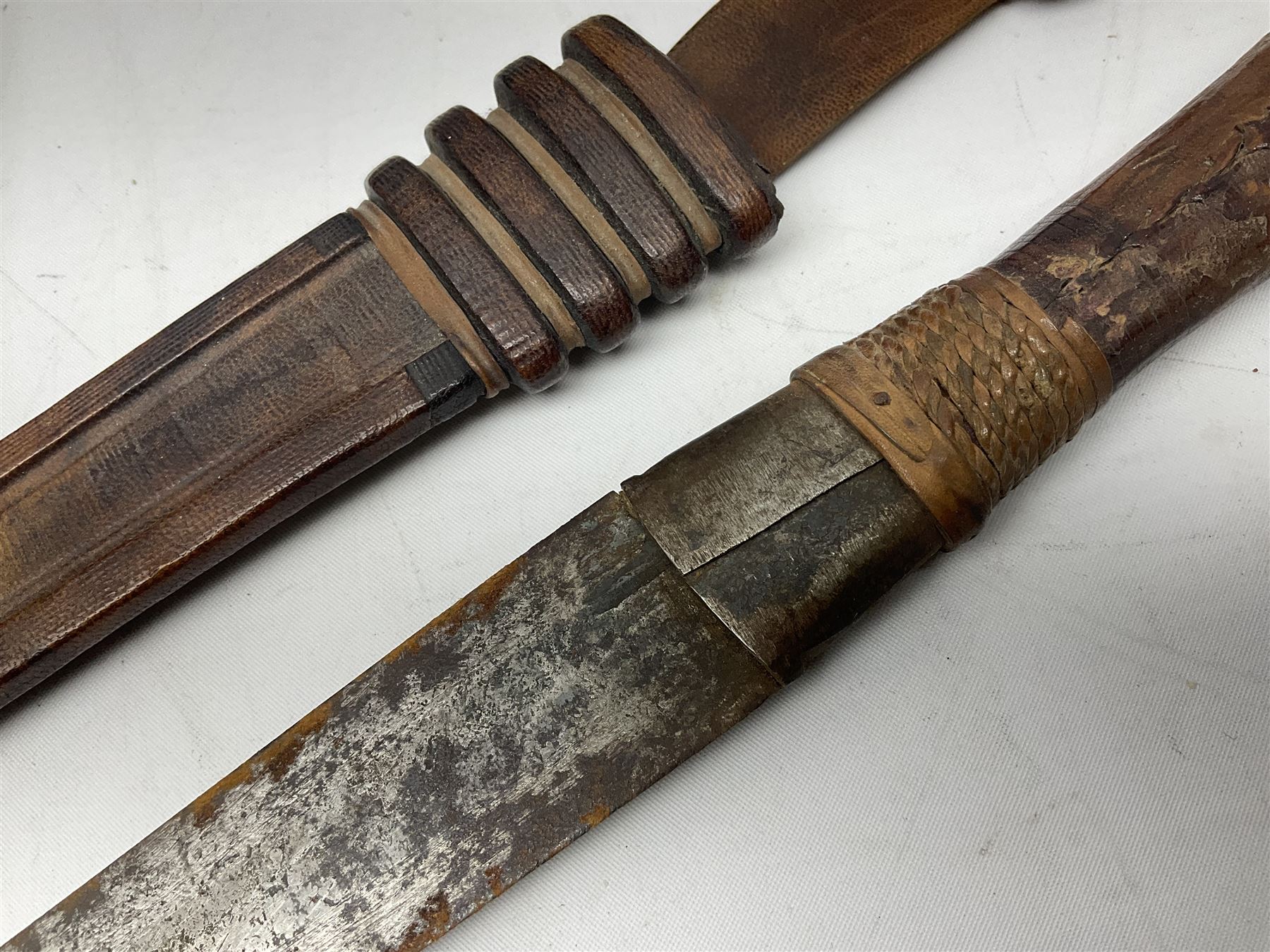 Two African tribal daggers, four carved masks/busts and similar collectables