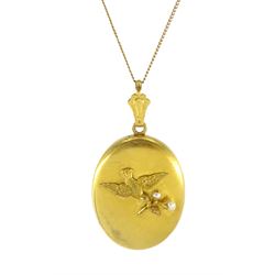 Victorian gold locket pendant, with applied bird carrying branch set with pearls decoratio...