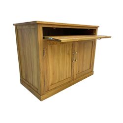 Contemporary light oak sideboard desk, rectangular top with full length drawer, hinged front panel revealing pull-out keyboard tray, over two panelled doors enclosing an assortment of shelves and compartments with cable management holes, on plinth base