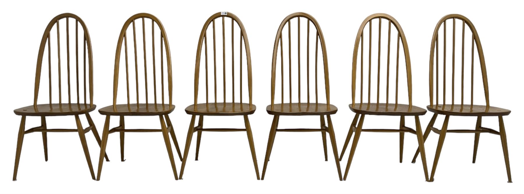 Ercol - light elm and beech set of ten (8+2) 'Quaker Windsor' dining chairs, high hoop and stick back over splayed supports united by H-stretcher, with foliate patterned crimson loose seat cushions