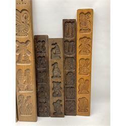 Nine 20th century hardwood Dutch folk art Speculaasplank or biscuit moulds, most examples typically carved with motifs including windmills, boats and squirrels, tallest H75cm