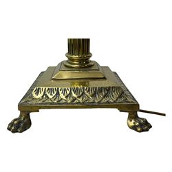 20th century brass standard lamp, Corinthian column stem on moulded square base with paw feet 