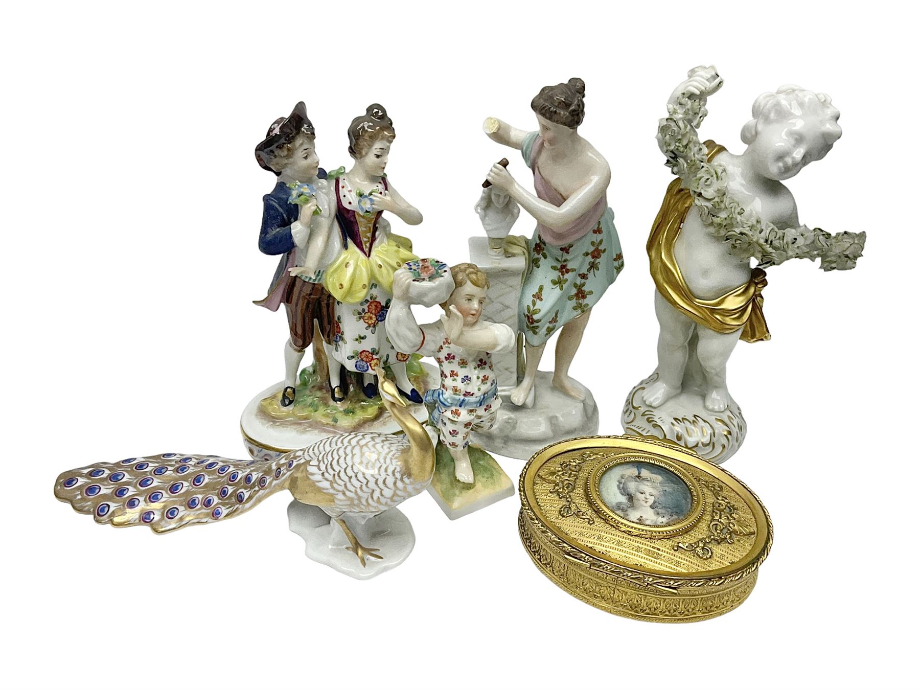 Chelsea style ceramic figure, modelled as a peacock, with gilt detailing throughout, together with four continental figures, including cherub with gilt draped fabric and floral garland and a courting couple etc, all with spurious marks beneath, and a gilt metal trinket box, with portrait of an 18th century female to centre, tallest H16.5cm