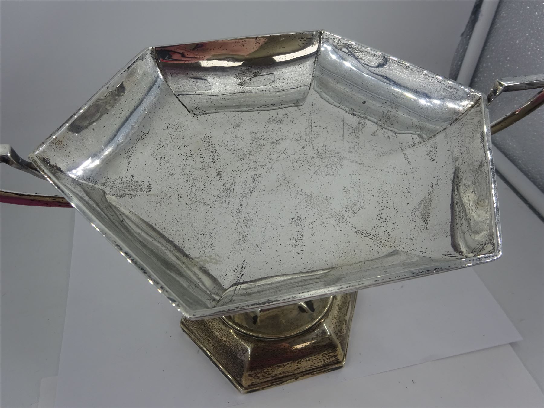 Early 20th century twin handled pedestal dish, of hexagonal form, with Art Nouveau inspired foliate mounted handles, upon a domed hexagonal foot, hallmarked Walker & Hall, Sheffield 1919, including handles H16.5cm