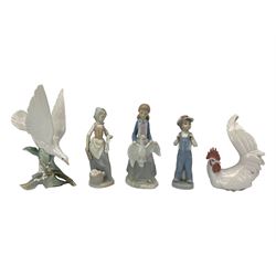 Seven Lladro figures including group of two doves, rooster, boy with accordion, deer, dove in flight , two geese and two Nao figures