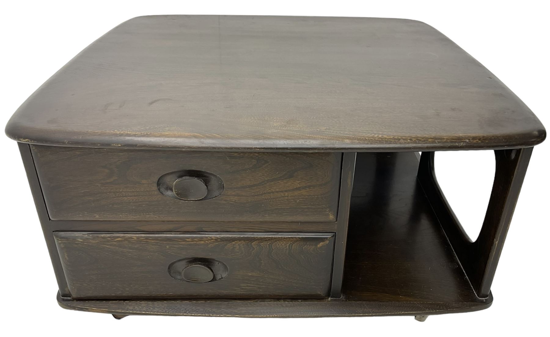 Lucian Ercolani for Ercol - dark elm 'Pandora's Box' coffee table, square top with rounded corners over two drawers with sculpted recessed pulls, open sides supporting undertier, on castors 