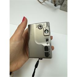 Eight Canon compact Ixus cameras, to include two Ixus examples serial nos. 2309147 & 2273184, Ixus M-1 serial no. 2932566, Ixus L-1 serial no. 2161988, Ixus Z90 serial no. 2201833,  Ixus X-1 serial no. 4704380, Z60IX serial no. 7474817, Ixus V2 serial no. 4431003237 and a Canon Powershot 350 digital camera serial no. H7MX00941