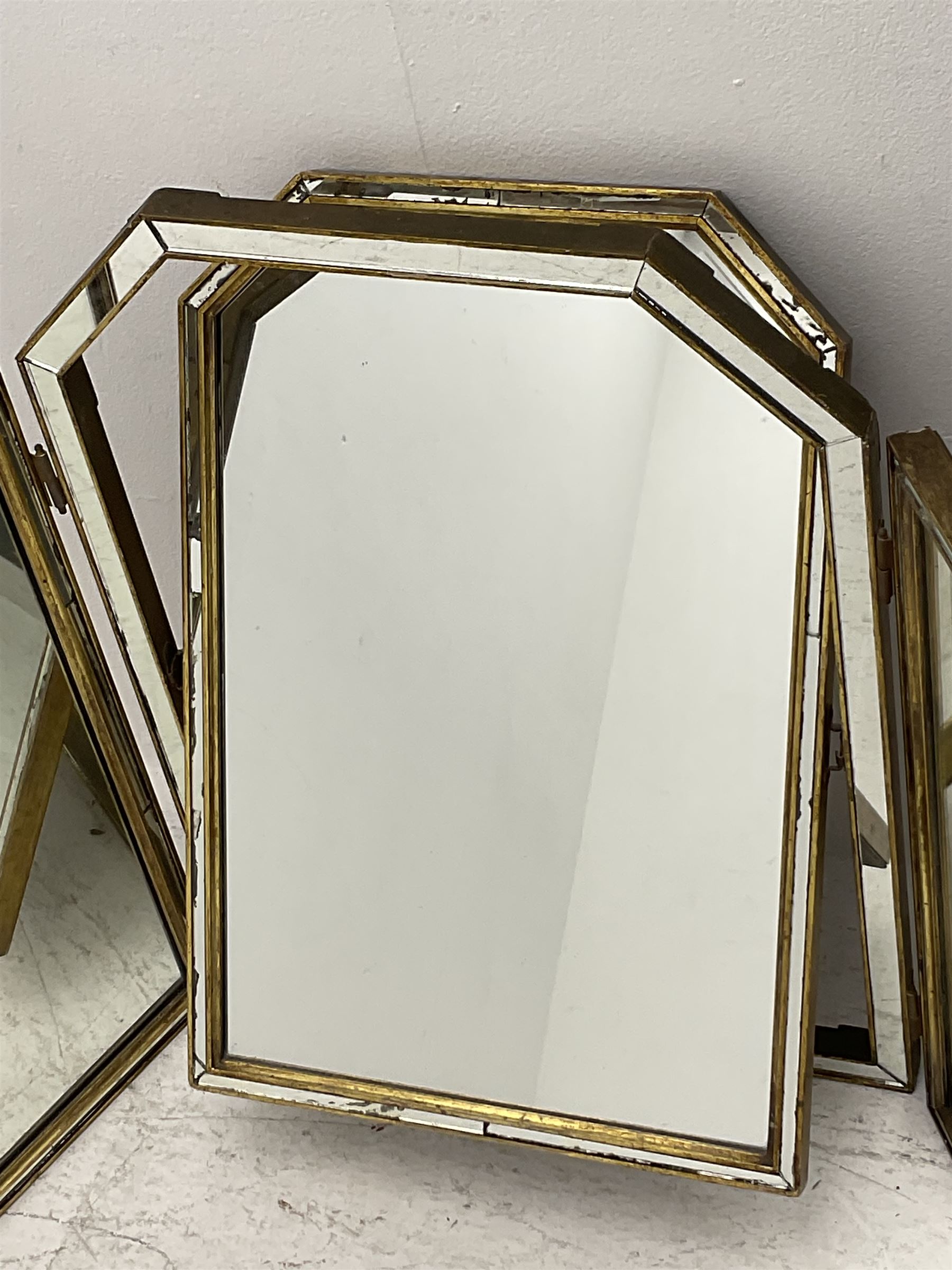 Triple dressing table mirror, central mirror with canted top, two flanking hinged mirrors