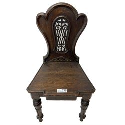 Victorian oak hall chair, the shaped back with fretwork splat, stepped moulded seat on turned lappet supports with fluting 