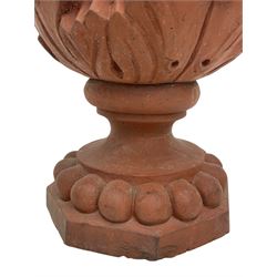 Pair of late 19th to early 20th century red terracotta garden urn planters, the shallow bowls moulded with curled acanthus leaf decoration, on circular foot with globular beaded moulding, octagonal base