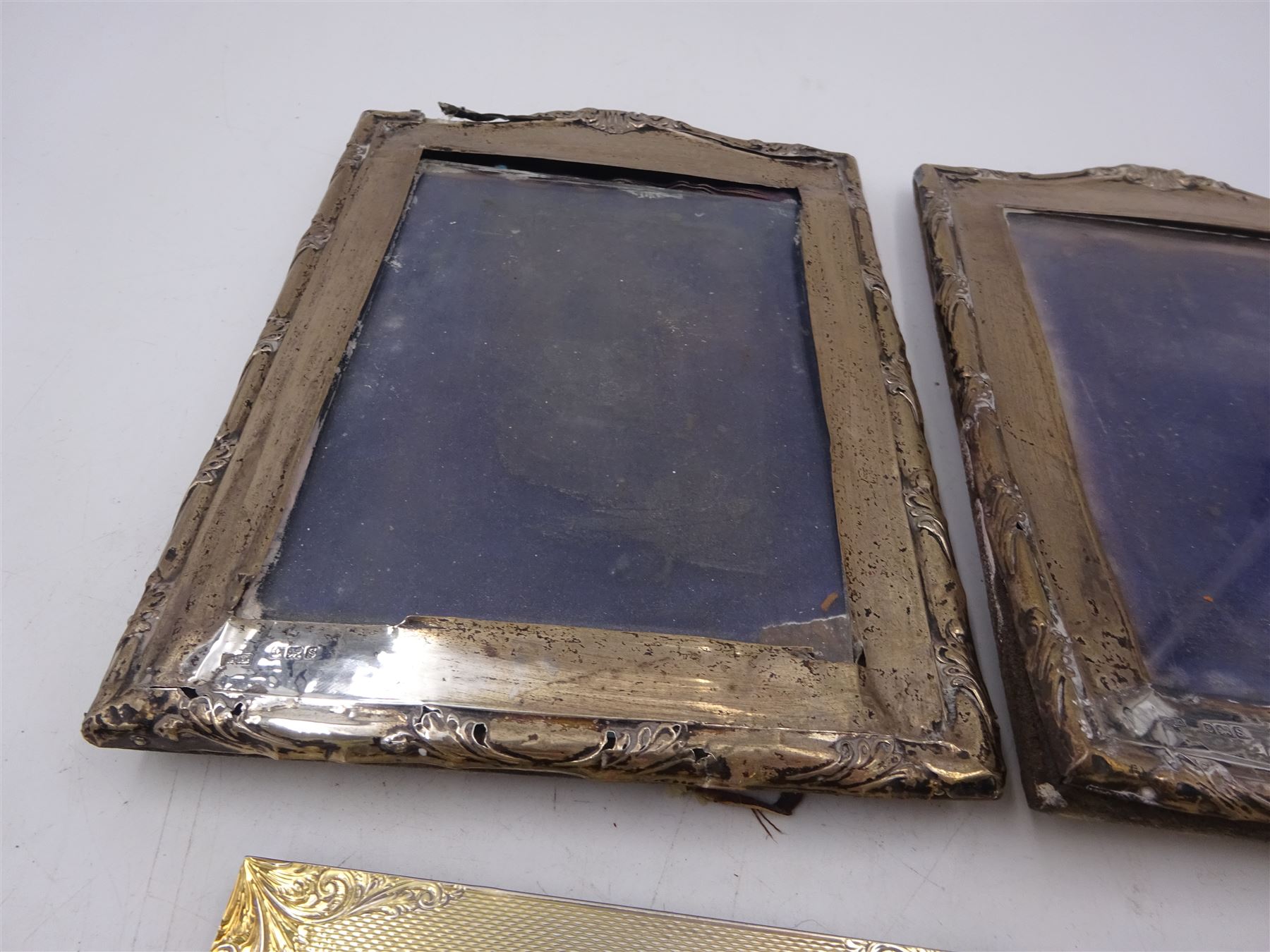 Four silver mounted photograph frames, comprising pair of early 20th century examples, and two smaller modern examples, all hallmarked, tallest H19cm