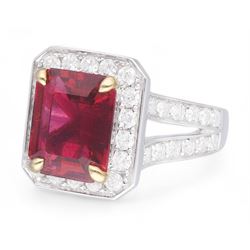 18ct white gold emerald cut rubellite tourmaline and round brilliant cut diamond cluster ring, with diamond set shoulders, hallmarked, rubellite 4.05 carat, total diamond weight 1.24 carat 