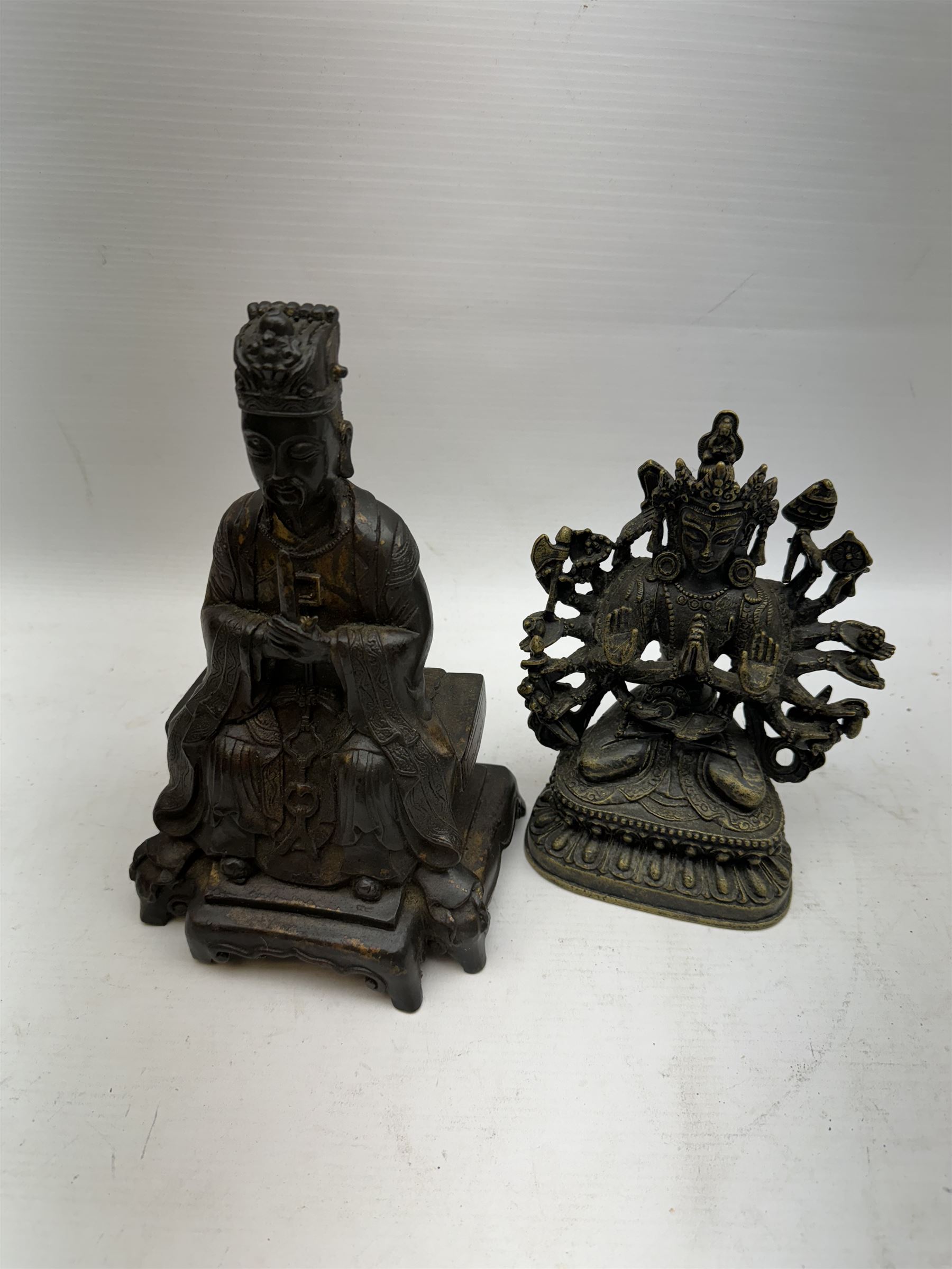 Chinese bronzed figure of Wenchang Wang (Wendi), with traces of gilt, together with Small brass Guanyin figure, largest H23cm