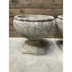 Pair of circular cast stone circular planters, and a similar pair decorated with swags (4)