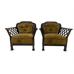 Early 20th century three-piece bergère suite - three seat sofa (W177cm, H82cm, D75cm); pair of matching armchairs (W84cm); single caned back with 'cock-pen' panelled arms, upholstered in foliate pattern fabric, blind fretwork lower frieze over square feet 