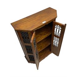 Hardwood and wrought iron cabinet, enclosed by two doors, on plinth base 