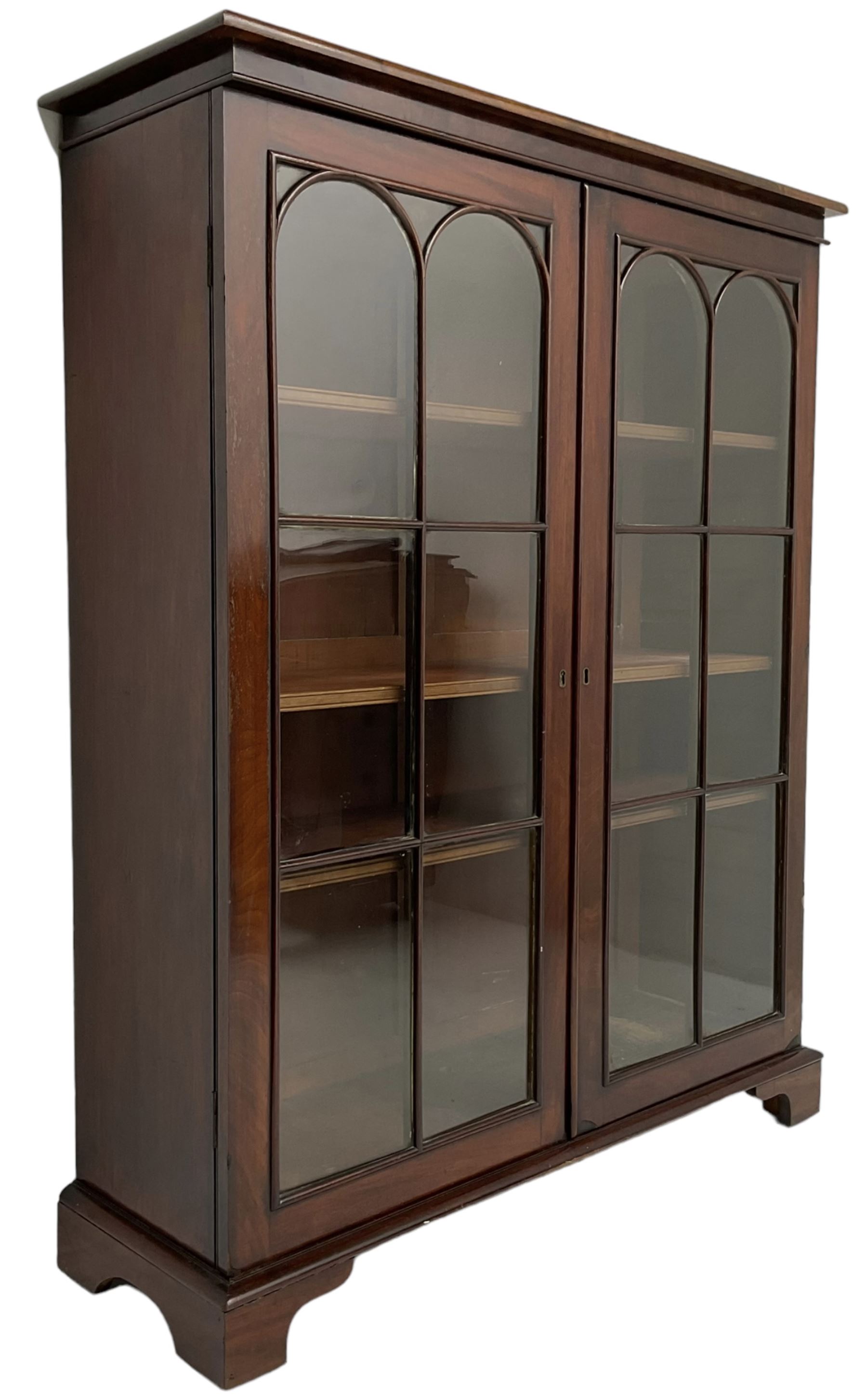 Early 20th century mahogany bookcase, fitted with two astragal glazed doors enclosing three adjustable shelves