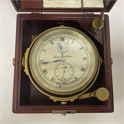 Two-day marine chronometer, with silvered dial inscribed Thomas Mercer Ltd, St Albans, contained within a brass gimbal-mounted bowl and glazed mahogany case, with applied brass plaque reading 'supplied by Kelvin Hughes no. 24295', brass winding key and two service notes to interior of case, dial D12cm, wooden case H17.5cm 