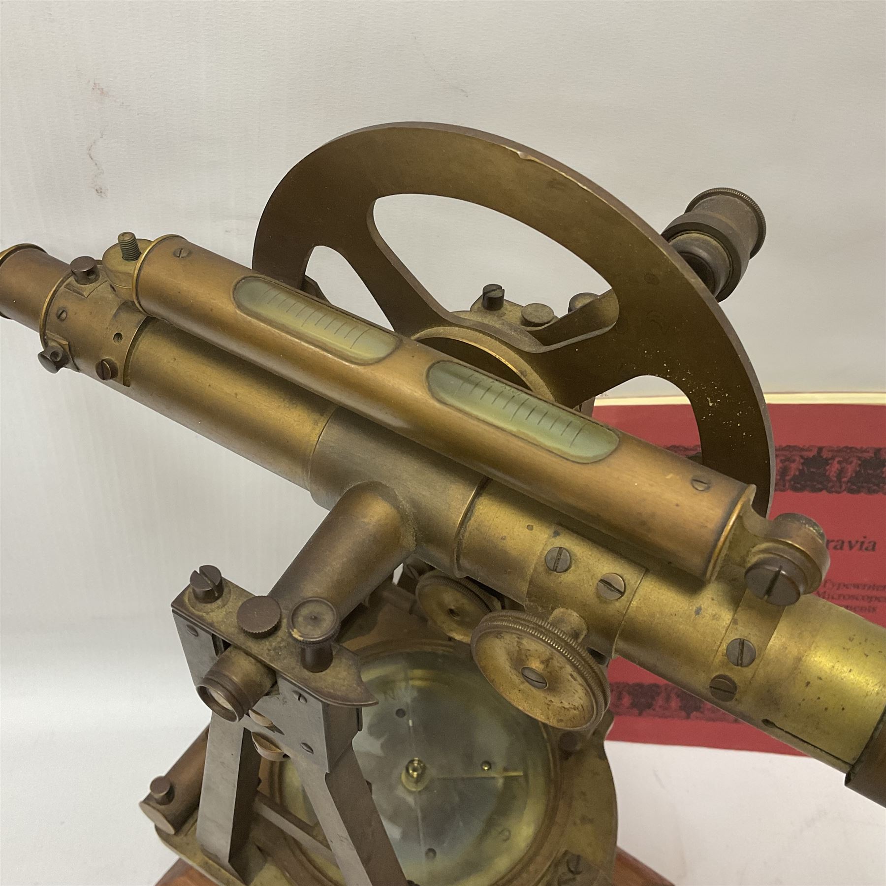 19th century brass transit theodolite by Troughton & Simms, the sighting telescope with rack and pinion focusing, above an inset compass, upon four levelling feet and a rectangular wooden base, including base H35.5cm