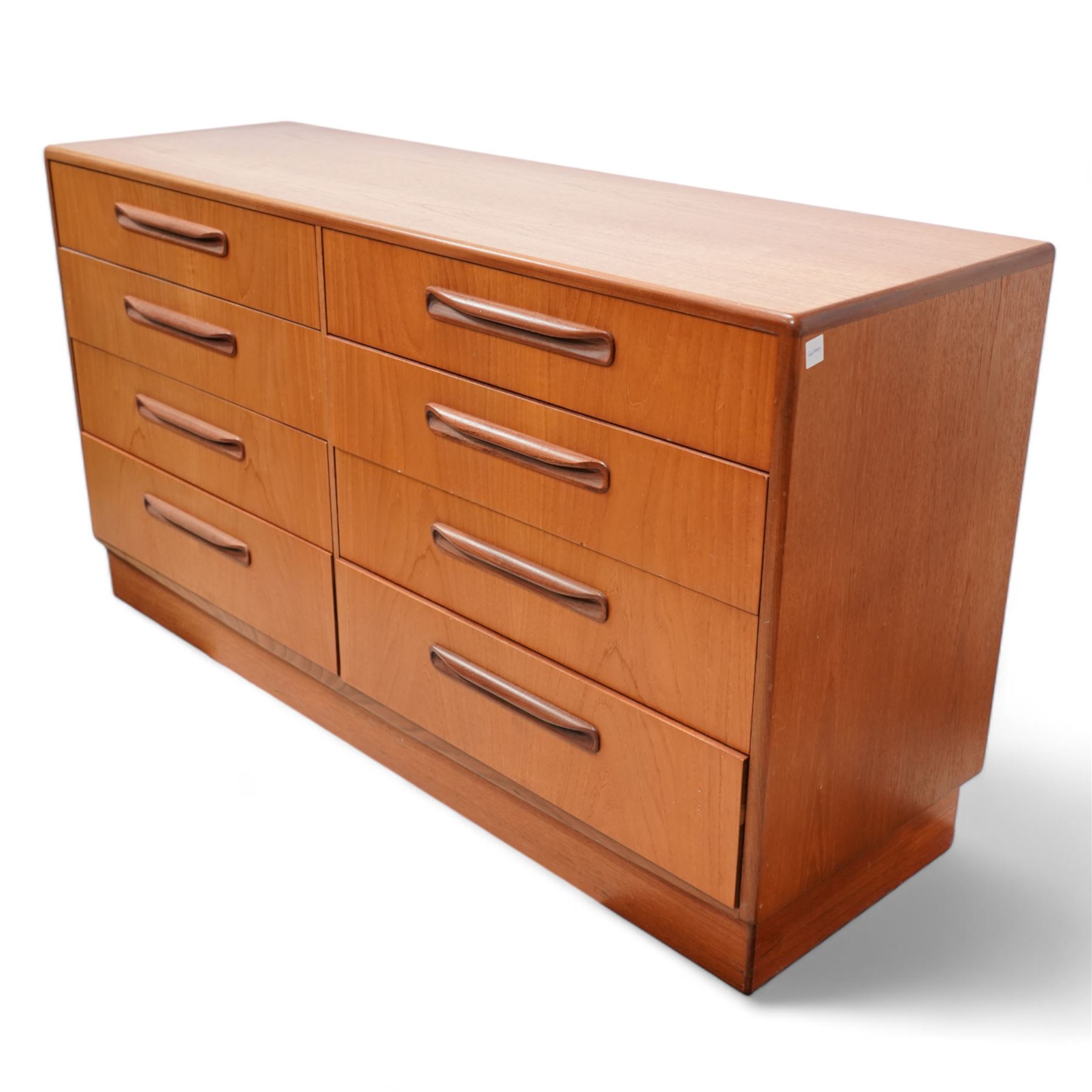 G-Plan - mid-20th century 'Fresco' teak wideboy chest, fitted with eight drawers, on skirted base