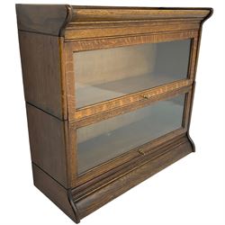 Globe Wernicke design - early 20th century oak two sectional library bookcase, enclosed by hinged and sliding glazed doors