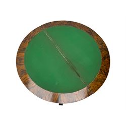 Victorian walnut demi-lune card table, circular fold-over top with foliate carved edge, revealing green baize-lined playing surface over scalloped apron, raised on a turned and carved pedestal with four splayed scroll supports with castors