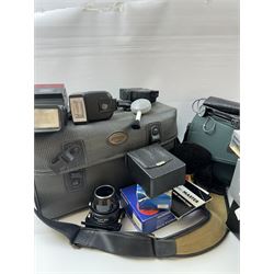 Collection of camera accessories, including Cobra 700AF flash, Weston Euro-Master exposure meter, cases, grips batteries, etc 