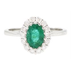 18ct white gold oval cut emerald and round brilliant cut diamond cluster ring, emerald app...