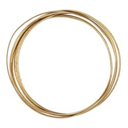 Seven 9ct gold bangles, with engraved decoration, all hallmarked