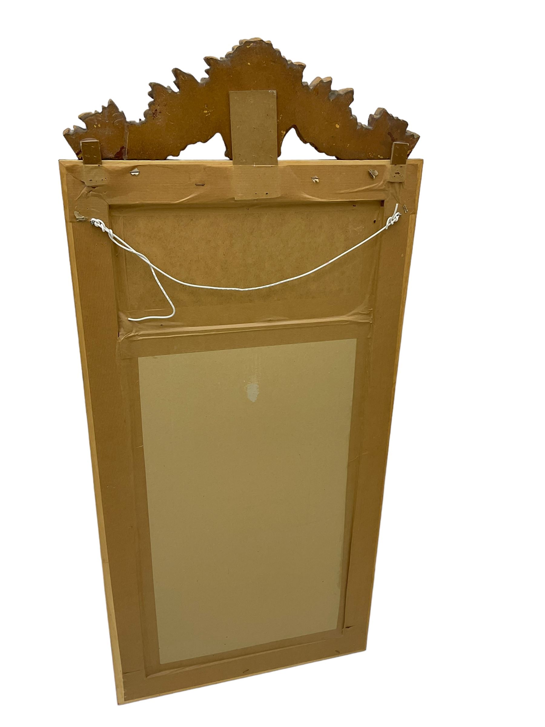 Spanish style wood and composite wall mirror, flower head pediment over plain mirror plate, foliate moulded frame