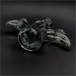 A Vannes French Art Glass candlestick, modelled in the form of a flame with twin branches, H8.5cm, together with a Baccarat glass mascot modelled as a butterfly, and a Baccarat glass dish. 