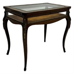 Victorian inlaid rosewood bijouterie table cabinet, shaped form, enclosed by hinged bevel glazed lid with shell and floral inlays, fabric lined interior, glazed sides within foliate cast gilt metal edging, on cabriole supports with floral cast gilt metal mounts and terminal caps 