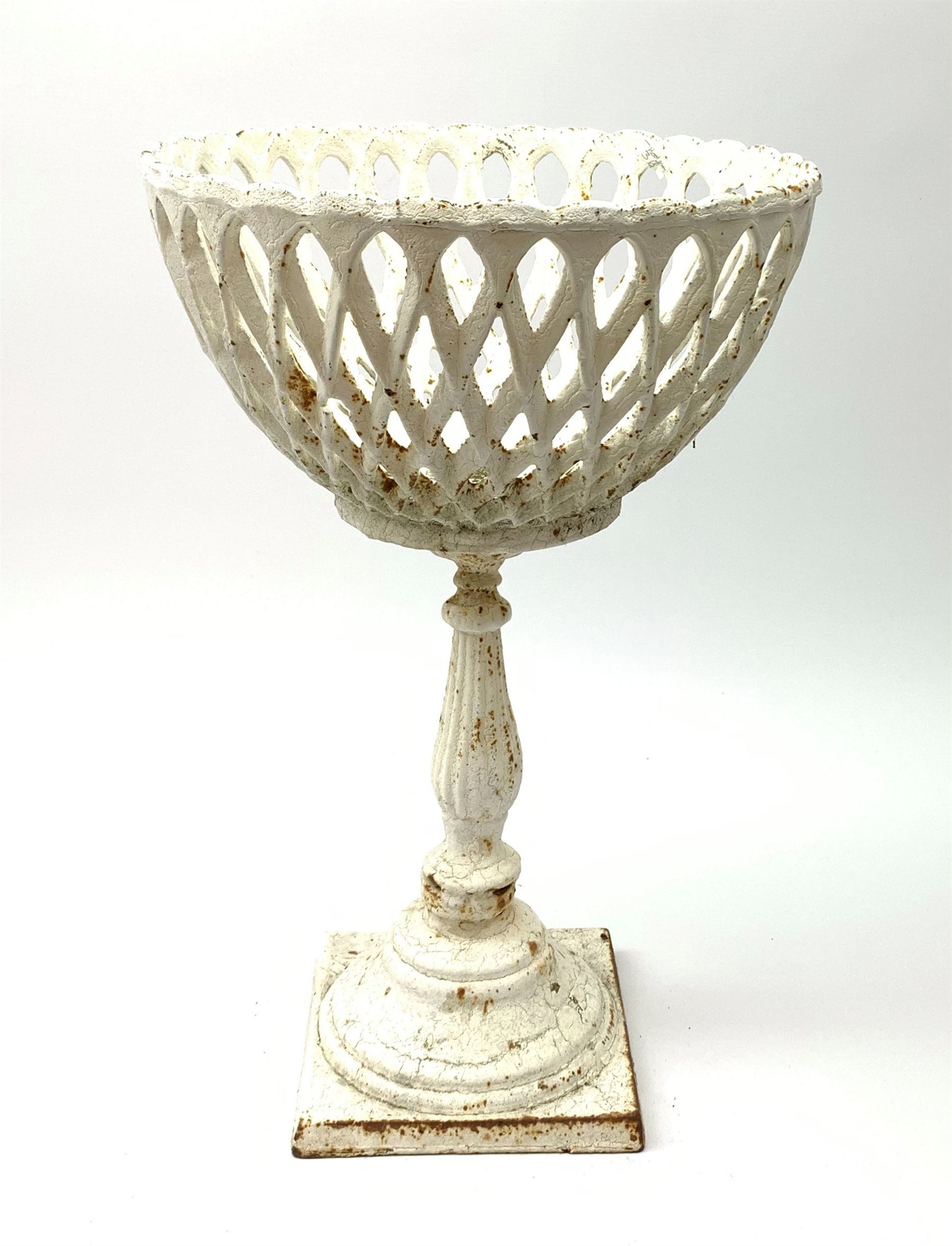 A cast iron white painted planter, of pedestal form with lattice bowl, H38cm. 