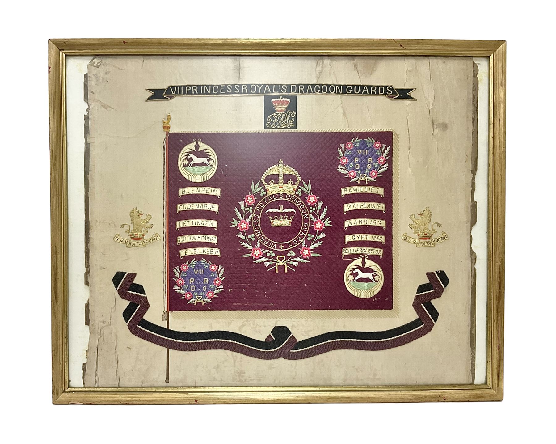 Commemorative Military needlework, headed 'VII Princess Royal's Dragoons Guard, the central flag has the regimental title, surrounded by a Union wreath of roses, thistles and shamrocks, topped with a crown, the Hanoverian white horse features in two corners, framed H58cm, L73cm