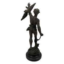 19th century French spelter figure 'Chasseur D'Aigles' on wooden base H48cm and a beaten copper circular tray inscribed with initials D61cm