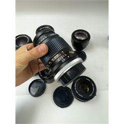 Seventeen Canon camera lenses, mostly FD examples, including 28-85mm 1:4 serial no, 49881, 35-105mm 1:3.5-4.5 serial no. 87632 and 135mm 1:2.8 serial no. 48336, one boxed