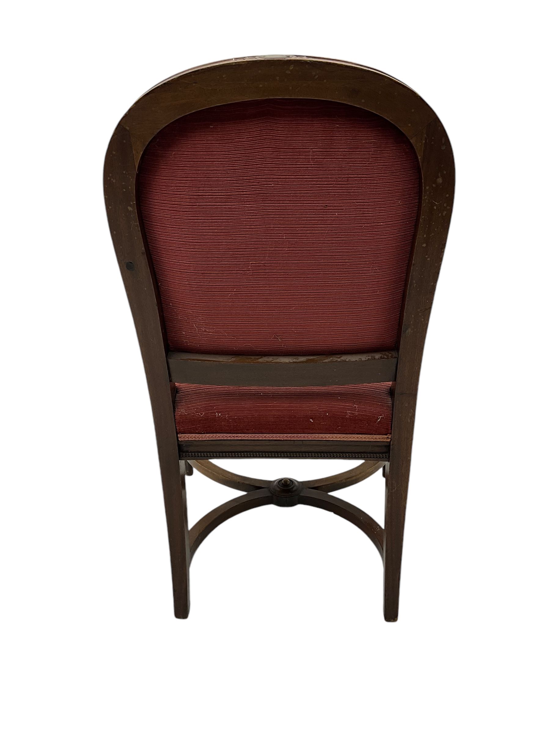 20th century French design mahogany fauteuil armchair, moulded and beaded framed, upholstered in pink fabric, rolled arms over acanthus leaf carved supports, on turned and fluted front supports united by curved X-framed stretcher 