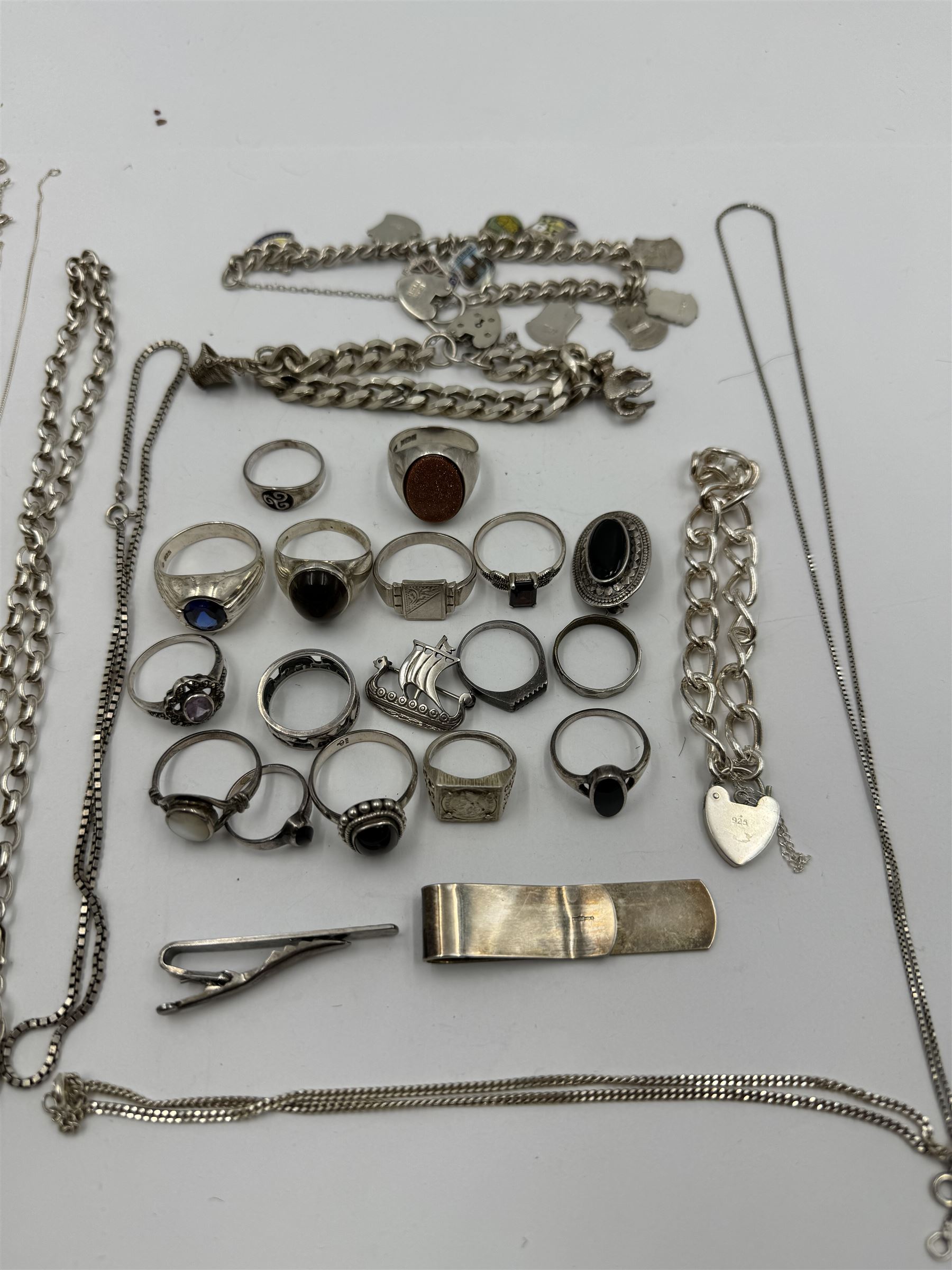 Collection of silver jewellery, including charm bracelet, stone set rings, money clips, chains, rings etc 