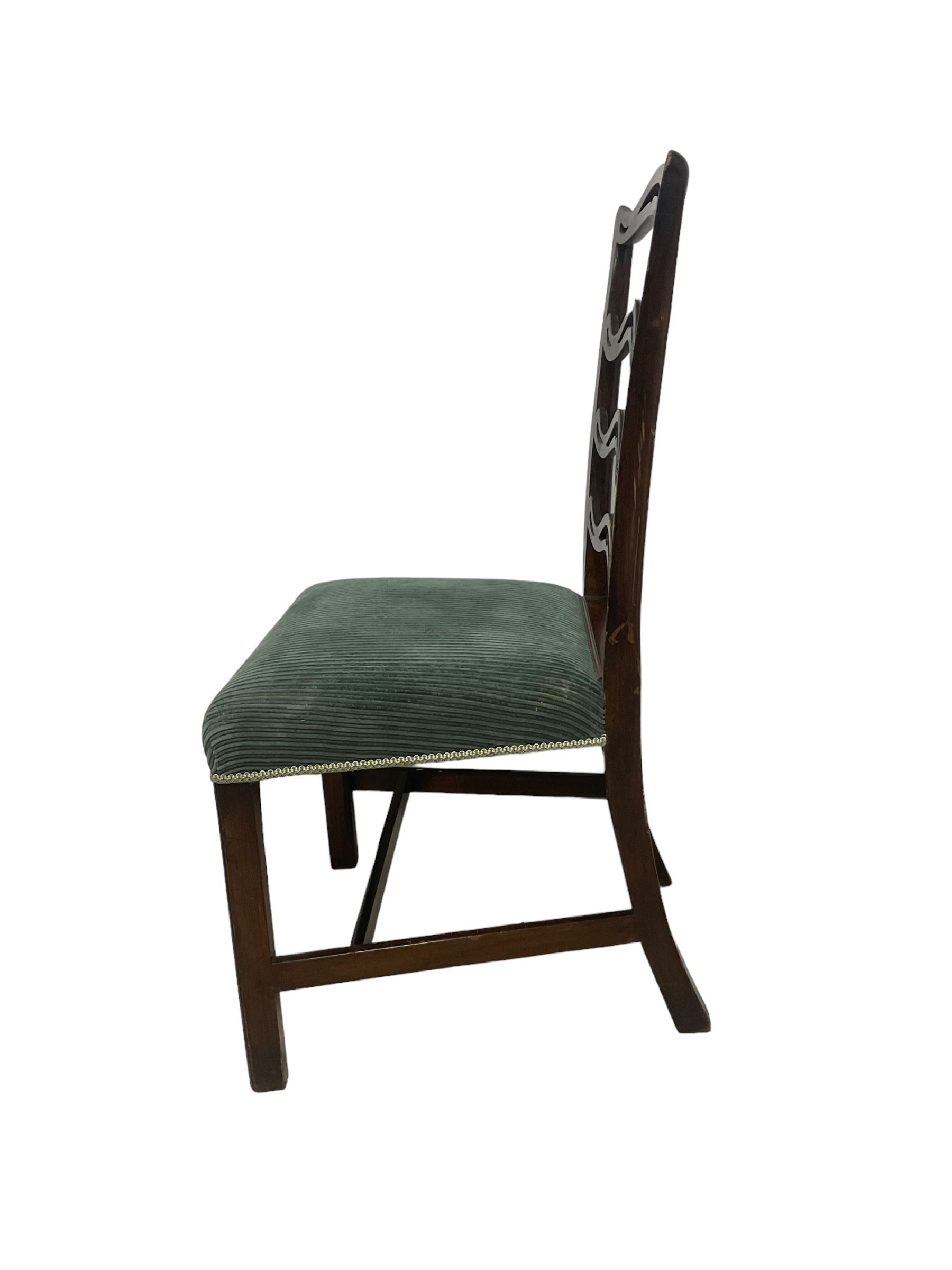 Set of twelve (10+2) Chippendale revival stained beech dining chairs, pierced waived ladder backs with over-stuffed over seats, on square moulded supports joined by stretchers