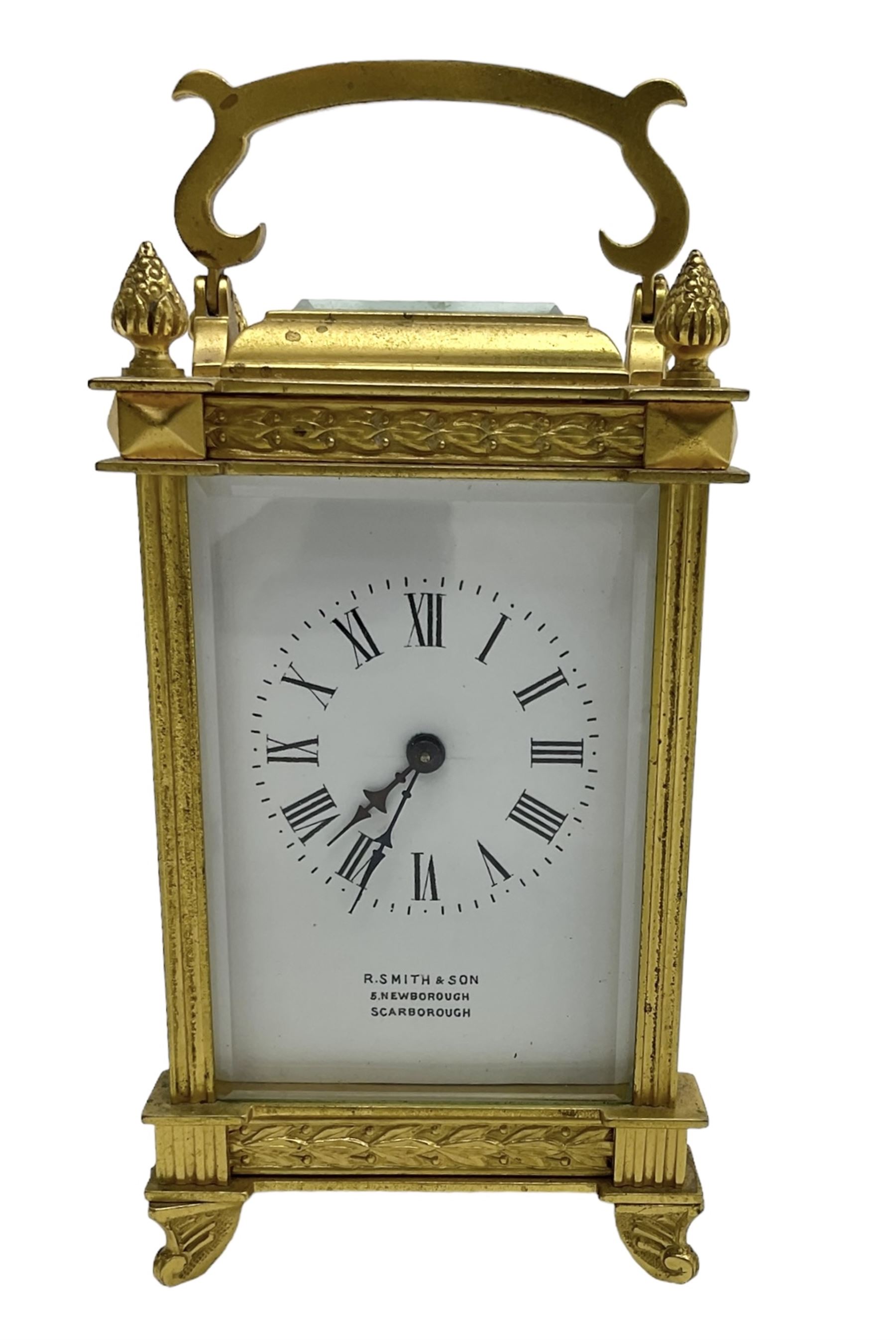 Early 20th century French carriage clock - 8-day timepiece movement in a decorative case with bevelled glass panels, white enamel dial with Roman numerals, minute markers and steel hands, retailed by Smith and Son, Scarborough, original lever platform escapement, with key.